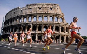 Marathon Runners Pass the Coliseum